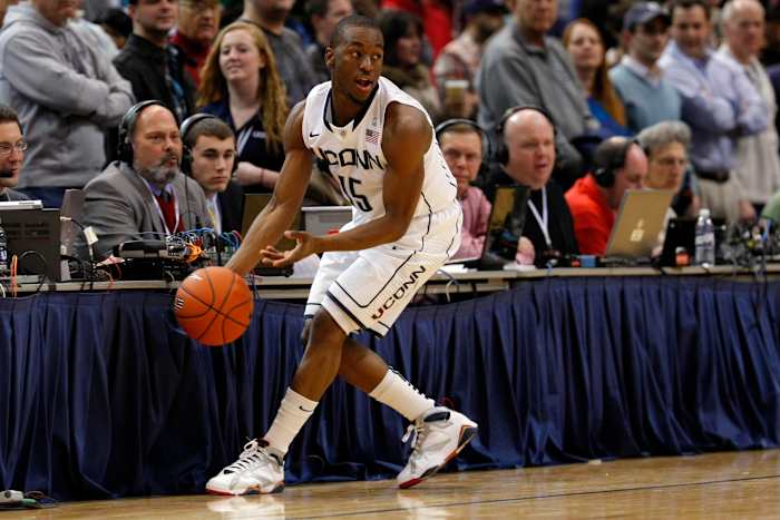 Connecticut Huskies guard Kemba Walker grabs the ball.